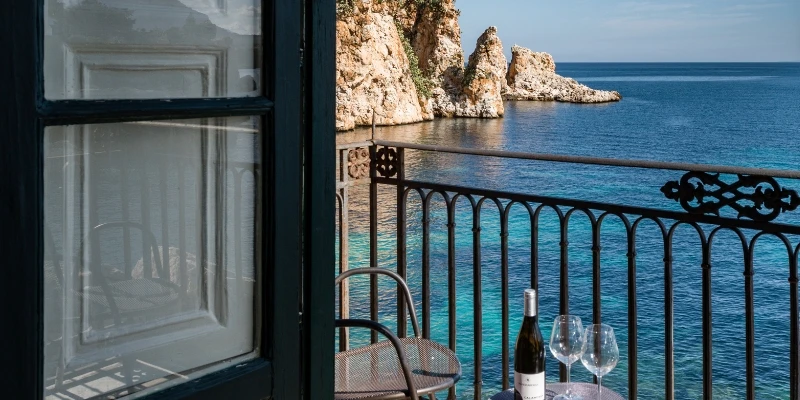 A room with a view directly on the rugged coast of Sicily