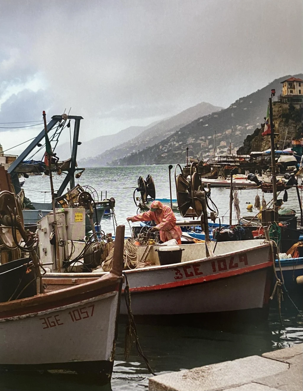 Fishermen in the harbour in Liguria