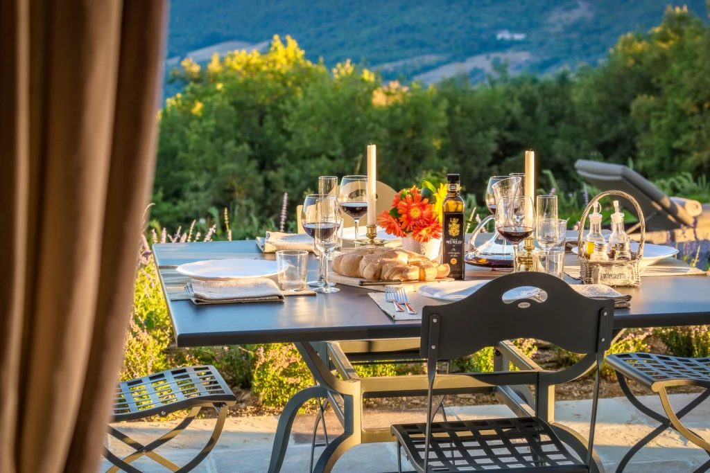 Outdoor dining with breathtaking views over the rolling hills of Umbria