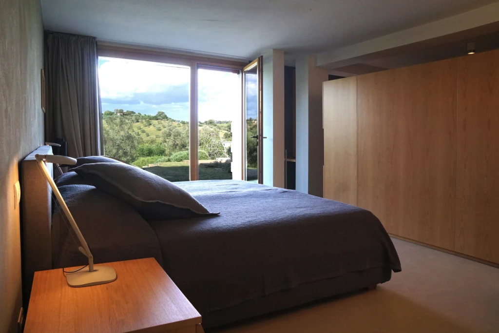 Large room with a comfortable king size bed and a beautiful view onto the olive grove and the garden.