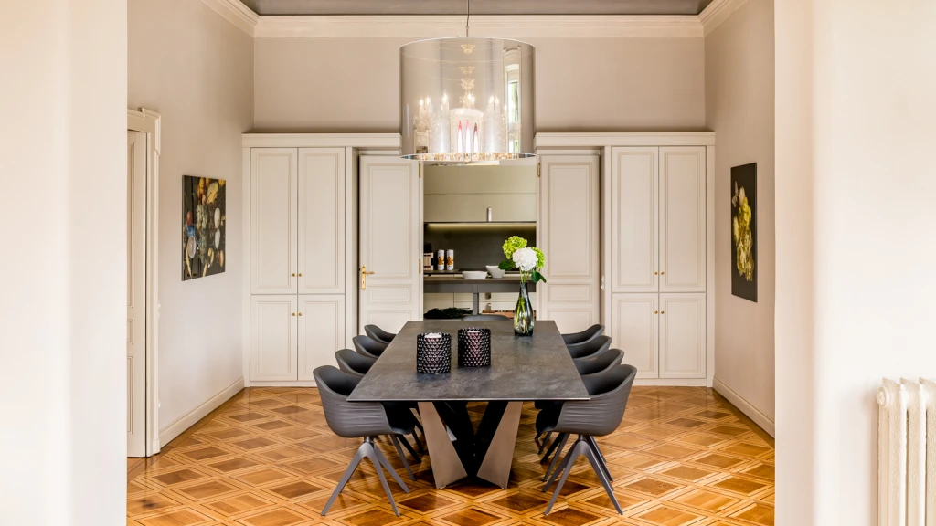 the dining room with a direct connection to a modern kitchen.