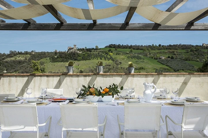 Large outdoor table for alfresco dining, overlooking  the rolling hills of Umbria